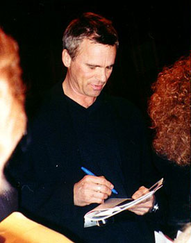 Richard signs autographs.