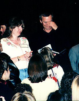 Richard signs autographs.