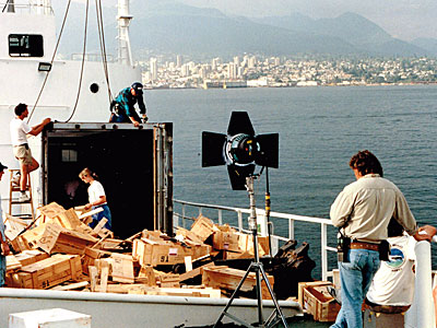 The crew prepares to shoot a scene on the deck of the ship.