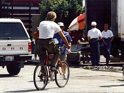 Richard rides his bike around the set