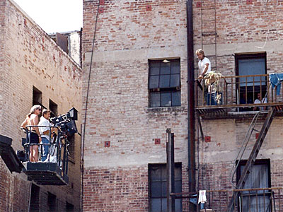 Richard climbs up the fire escape